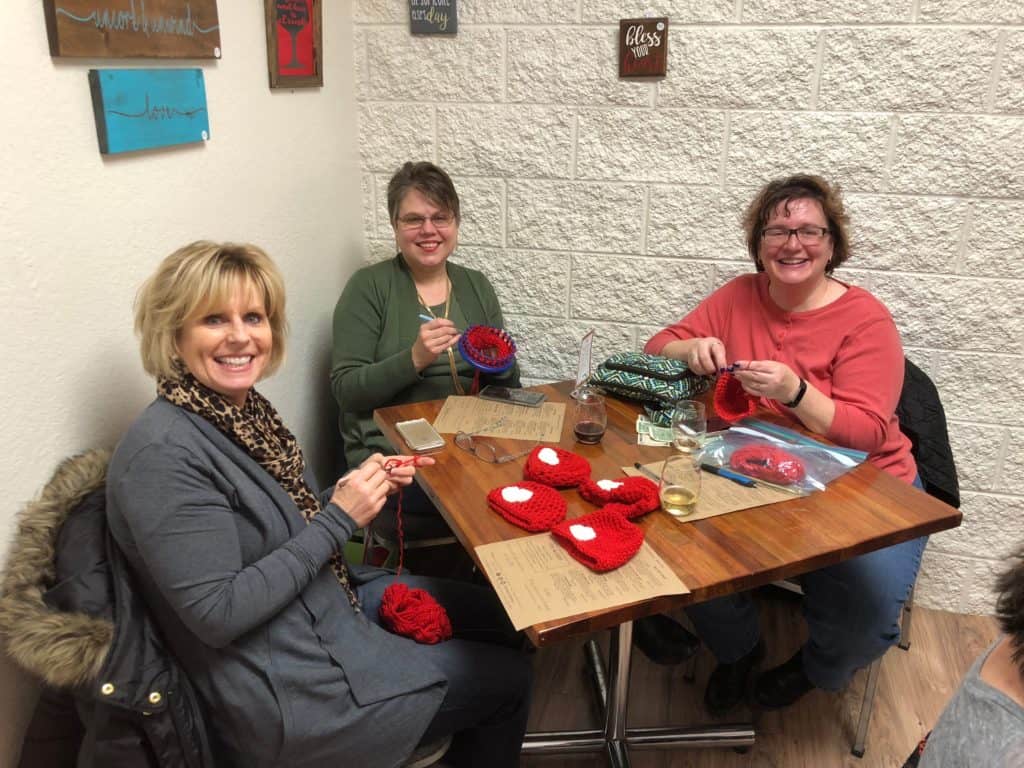 Red Hat knitting and wine